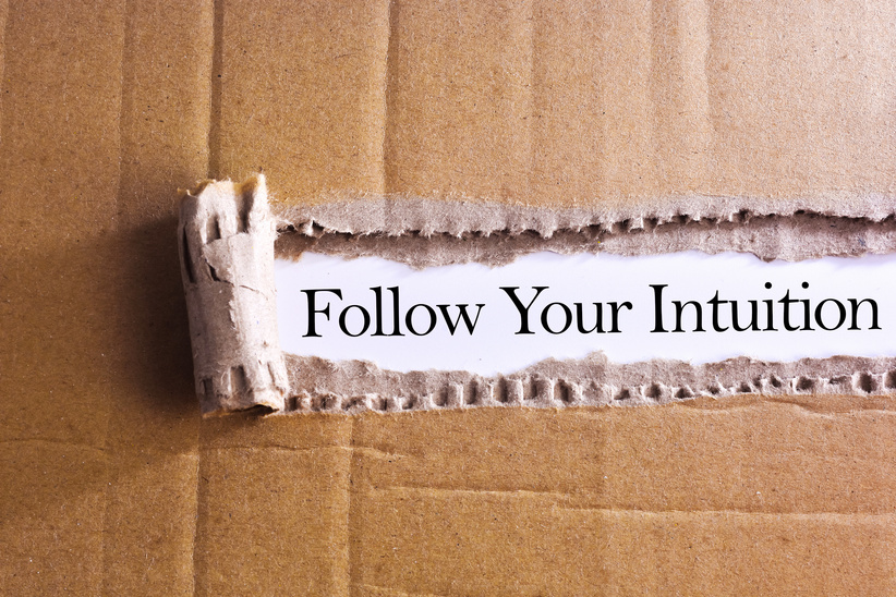 Torn paper box with word Follow your intuition